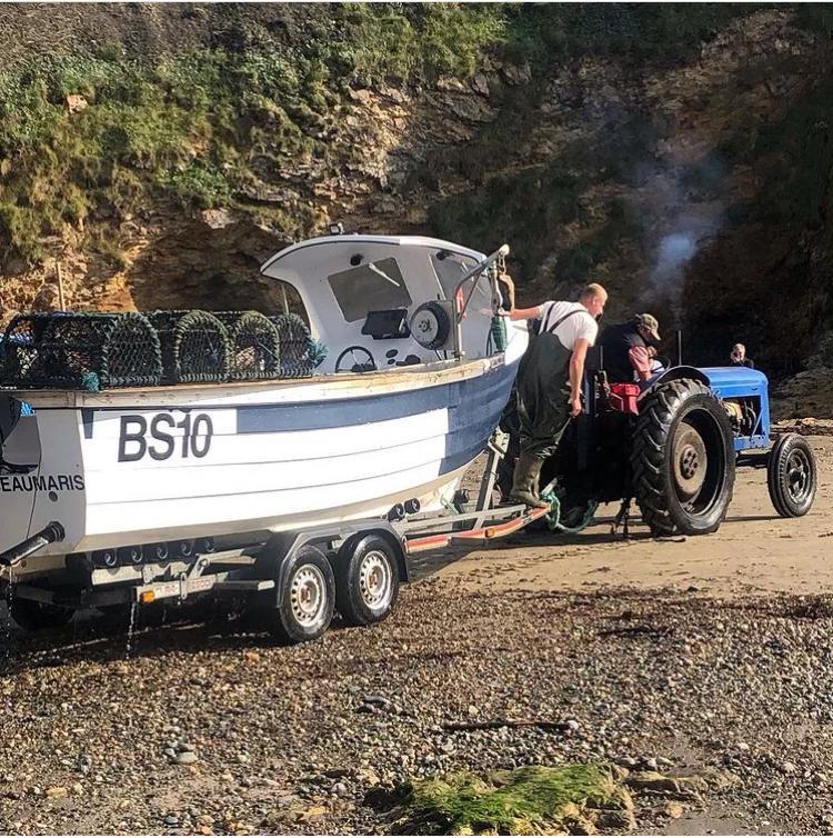 Local fishing boat BS10 Beaumaris being launched at Church Bay
